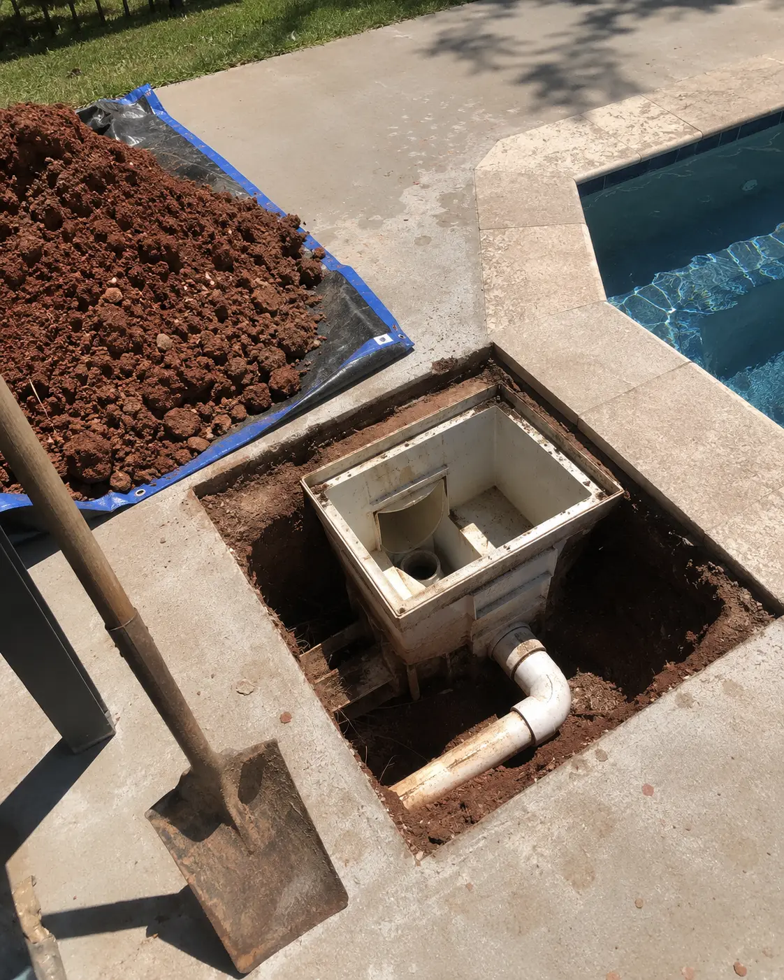 Excavated pool skimmer and underground plumbing prepared for repair